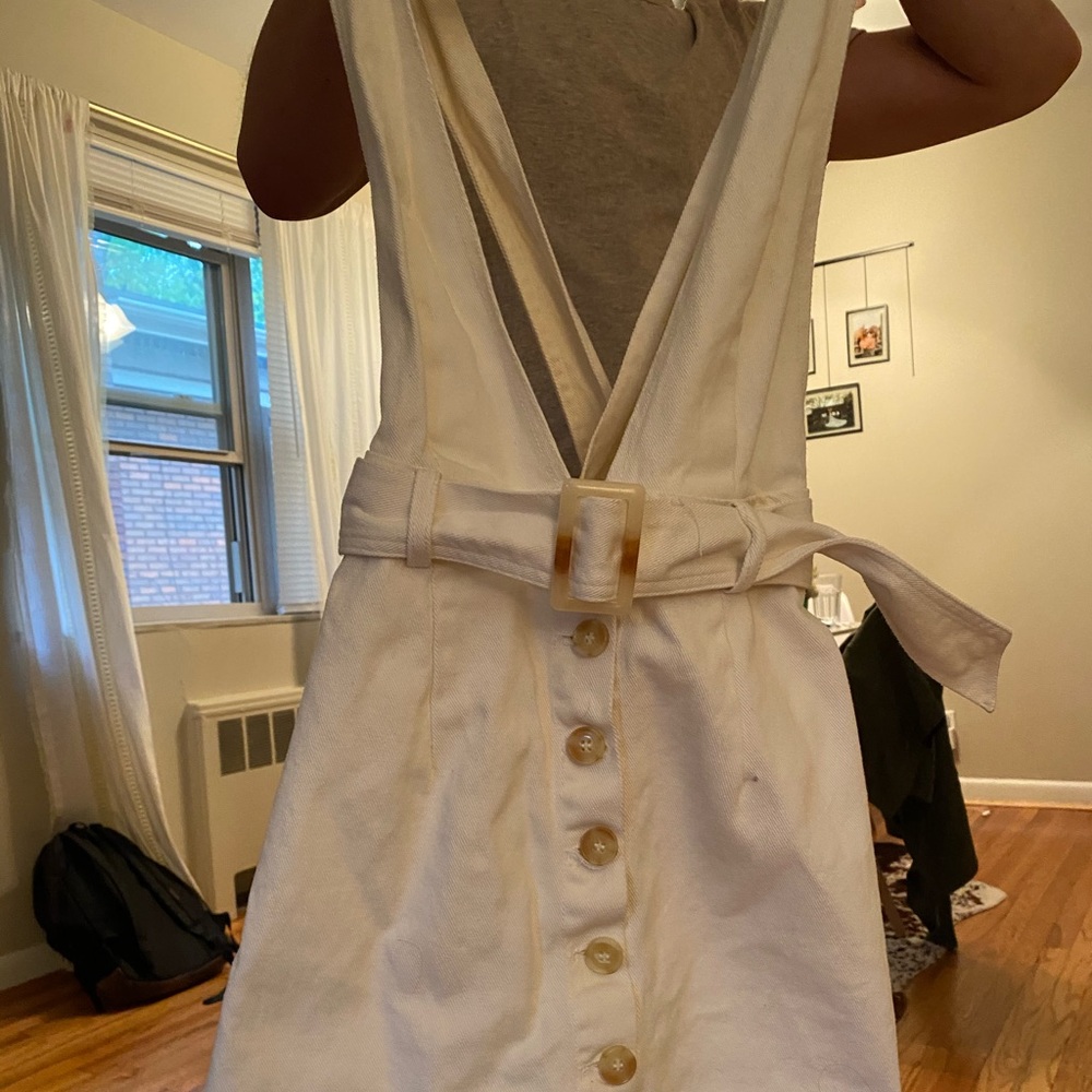 White dress with buttons on the front